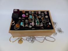 A collection of forty silver rings to include tiger's eye, pressed amber, marcasite, malachite,