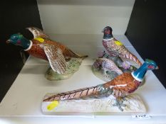 Two Beswick pheasant figures and a Crown Staffordshire example