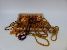 A large collection of amber including cherry amber necklace,