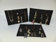 A collection of silver earrings to include agate, garnet, moonstone, paste,