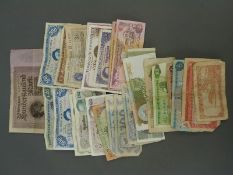 A collection of world bank notes in used condition, but some still crisp,