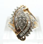 A 9ct gold ring set with baguette and round cut diamonds in a cluster, size P, 4.