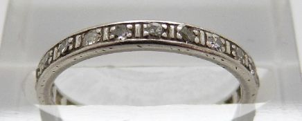 A platinum eternity ring set with diamonds, size K, 2.
