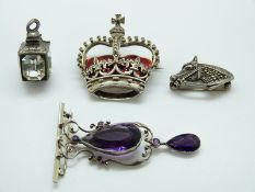 A hallmarked silver brooch in the form of a crown set with red enamel and marcasite,