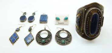 An Indian white metal bangle set with lapis lazuli, similar earrings,