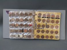 An amateur coin collection contained in an album to include UK, France, Ireland, Denmark,
