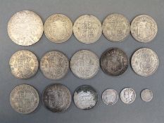 Approximately 153g of pre 1947 English silver half crowns together with a Maria Theresia coin,