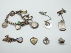 A silver charm bracelet, silver necklace, mother of pearl heart necklace, moonstone necklace,