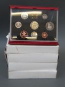 Four Royal Mint deluxe proof coin sets for 1995, 1996, 1997 and 1998,