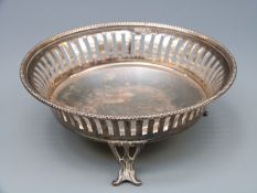 A Walker & Hall George V hallmarked silver pierced bon bon dish raised on three feet,