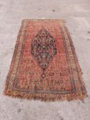 A 19thC/20thC Persian carpet with central blue gul,