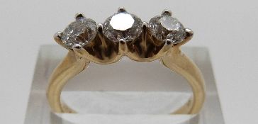 A 9ct gold ring set with three modern round brilliant cut diamonds totalling approximately 1ct,