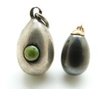 A Russian silver egg pendant marked 84 set with a turquoise cabochon,