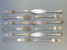 A set of six Victorian hallmarked silver beaded edge fish knives and forks,
