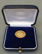 A French/Swiss gold coin celebrating 50 years of world thrift, marked .