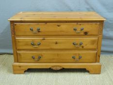 A pine dressing chest with swing frame mirror above,