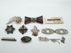 A silver brooch set with labradorite, a brooch set with green cabochons, a micro mosaic brooch,