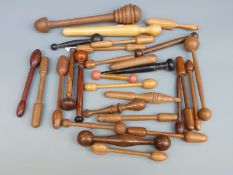 A large collection of 19th/20thC turned wood glove darners including examples inscribed Ambleside