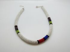 An Art Deco beaded 'snake' scarf and other beaded items