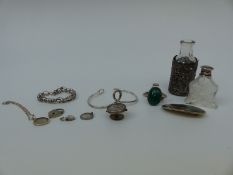 A silver Mexico brooch, Victorian silver button, two silver bangles, silver sleeve for a bottle,