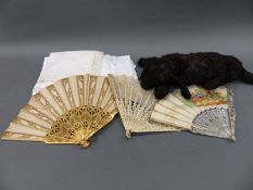 Three fans including mother-of-pearl and gilded together with a small quantity of textiles and a