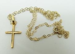 An 18ct gold cross pendant and a 9ct gold chain