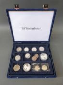 A collection of USA half dollars and two 'Walking Liberty' silver dollars in Westminster case,