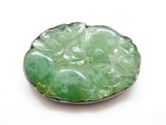 A jadeite brooch carved in the form of pomegranates