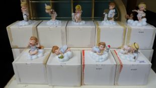 Fourteen 'Almost Angels' figures by Franklin Mint with display case