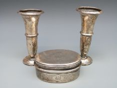 A white metal travelling dressing table pot and two hallmarked silver trumpet vases, height 12.