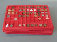 A large amateur collection of UK and overseas coinage in collection trays includes 17thC tokens,