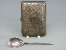 A hallmarked silver cigarette case with engraved decoration and a hallmarked silver spoon,
