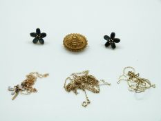 A pair of yellow metal earrings set with sapphires in a flower cluster,