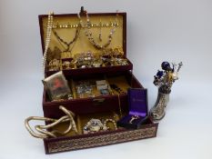 A collection of hat pins in a shoe pin cushion and a collection of costume jewellery in leather