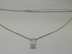 An 18ct white gold chain and a pendant set with diamonds in a rectangular setting