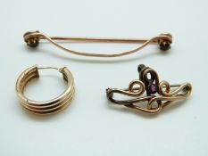 A yellow metal brooch set with garnets (4.