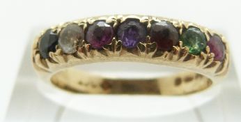 A 9ct gold ring set with seven gemstones spelling out 'regards' (ruby, emerald, garnet, amethyst,