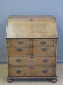 A small Georgian mahogany bureau with fitted interior,