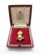 A 9ct gold Royal Artillery sweetheart brooch with 'Ubique' motto,