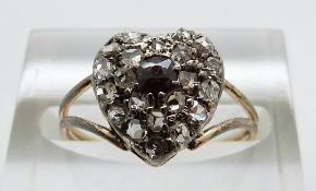 An early Victorian heart shaped ring set with an amethyst surrounded by rose cut diamonds, size L,