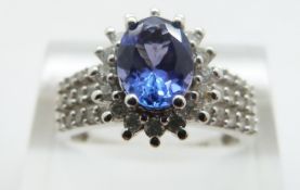 A 14ct white gold ring set with a tanzanite and diamonds, size O, 4.