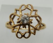 A 9ct gold ring set with a cubic zirconia (1.