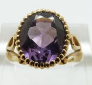 A 9ct gold ring set with an amethyst, size M, 4.