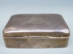 A hallmarked silver cigarette box with inscription 'Presented by Vickers Ltd,