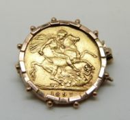 An 1897 gold full sovereign in yellow metal mount,