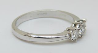 An 18ct white gold ring set with three diamonds totalling approximately 0.