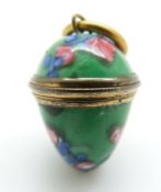 A 19thC egg pendant set with glass with screw top,