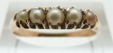 A yellow metal ring set with pearls, size P, 2.