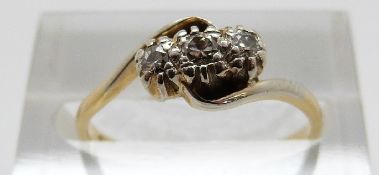 An 18ct gold ring set with three diamonds in a twist setting, Size M, 2.