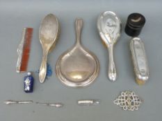 A hallmarked silver mounted four piece dressing table set comprising hand mirror,